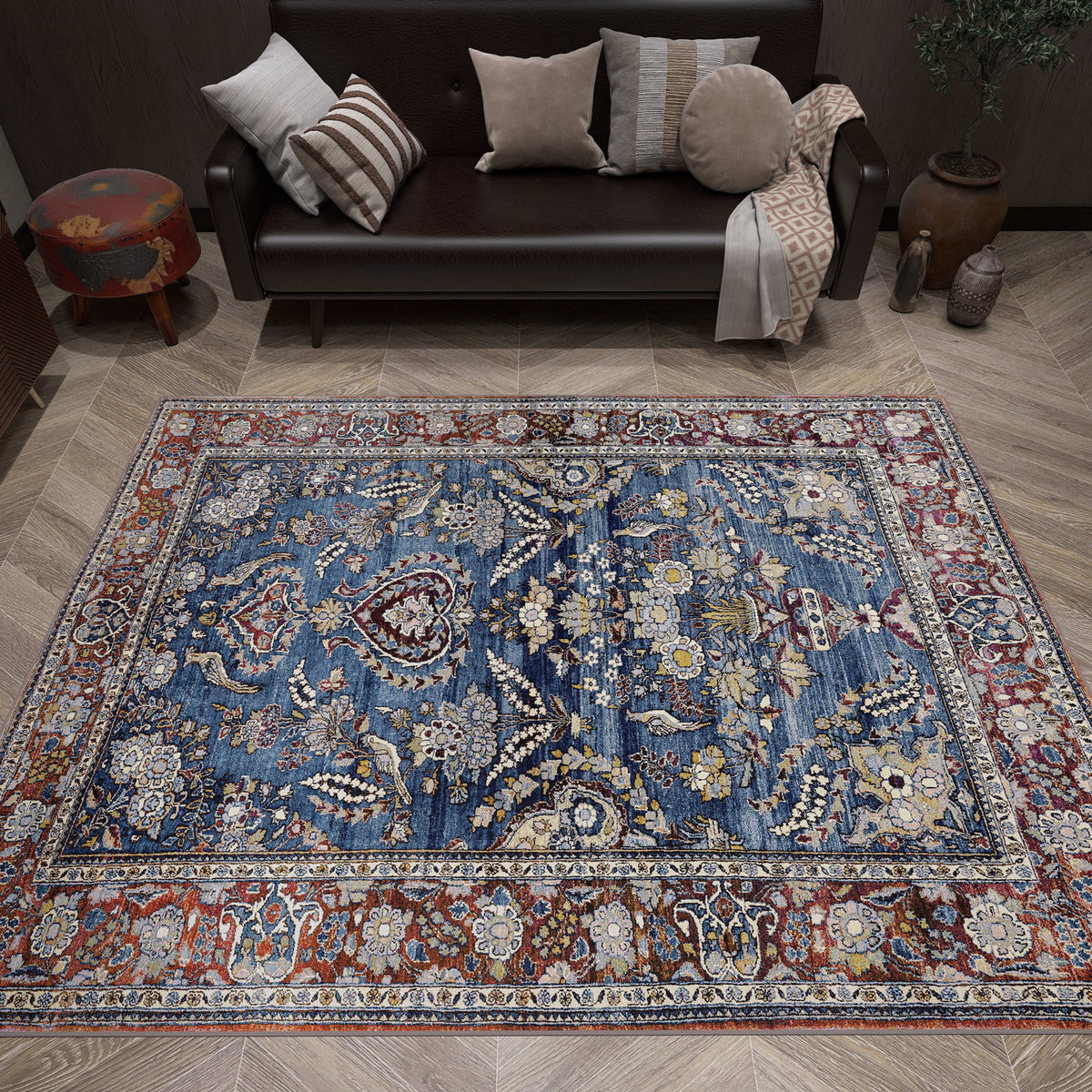Blue and red traditional Persian-style rug with intricate floral patterns, styled in a living room.