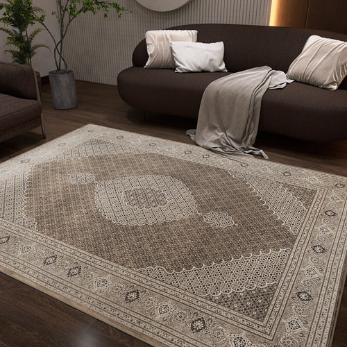 Load image 1 in gallery view. Brown and beige traditional rug with a central medallion and ornate border, styled in a modern living room.