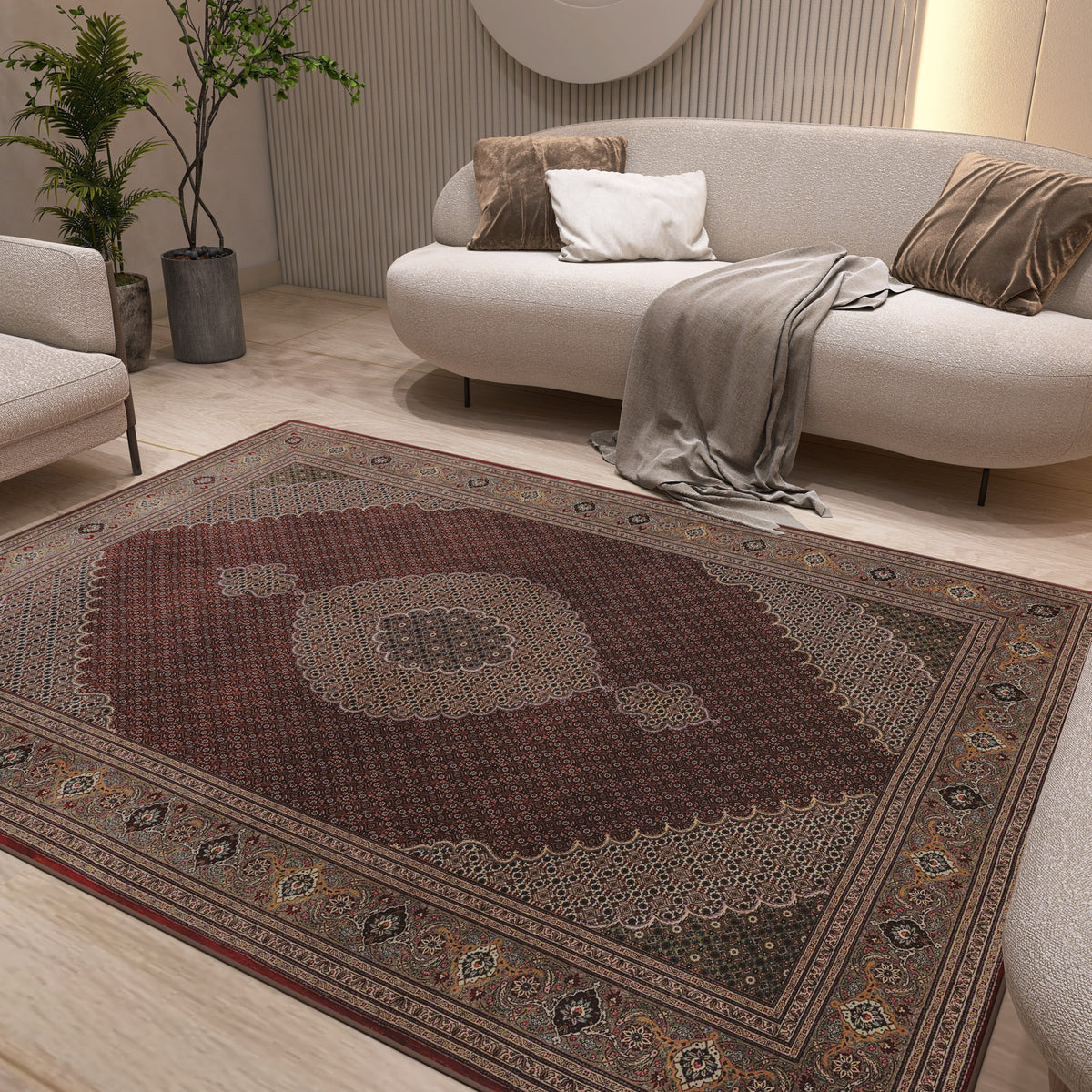 Deep red traditional rug with a central medallion and ornate border, styled in a modern living room.