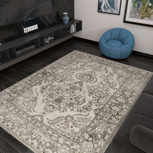 Load image 1 in gallery view. A living room with dark wood floors, the Velvet Mosaic - Washable Rug - JRN1004 (Custom Size) in beige patterns, a blue bean bag chair, a low media console with a vase, and framed artwork creates a cozy vibe for traditional interiors.