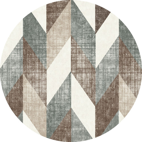 Load image 1 in gallery view. Round rug with a geometric chevron pattern in shades of brown, grey, and cream with a textured, distressed finish.