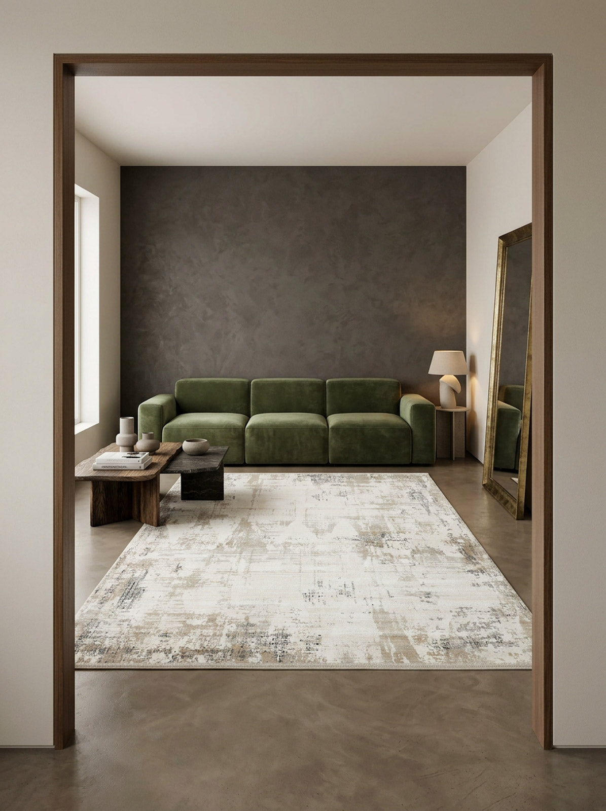 Cream and grey abstract distressed rug in a modern living room with a green sofa.