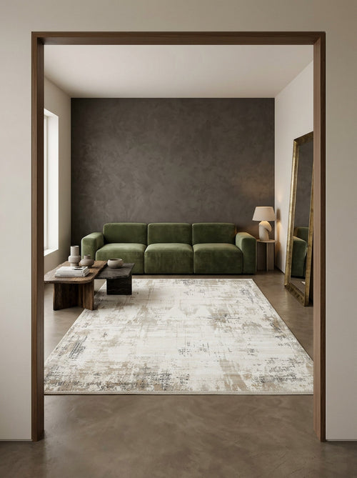 Bild 1 in Galerieansicht laden. Cream and grey abstract distressed rug in a modern living room with a green sofa.
