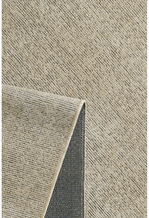 Bild 1 in Galerieansicht laden. A close-up of the Velvet Touch Beige Area Rug - PST002 shows its textured surface with a subtle grid pattern, and one corner folded to reveal the darker, non-slip backing.