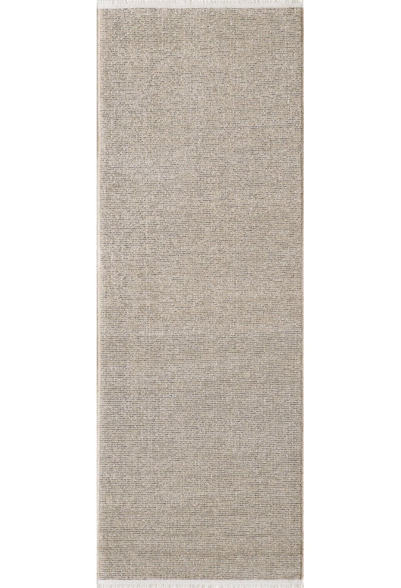 The Velvet Touch Beige Area Rug - PST002 features a rectangular, light gray woven design with a subtle textured pattern and thin white fringe on its shorter ends.