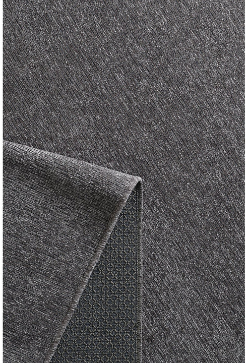 Load image 1 in gallery view. A close-up of the Velvet Touch Dark Gray Area Rug - PST004 reveals its subtle diagonal texture and non-slip diamond grid backing, making it ideal for fans of modern rugs and minimalist design.