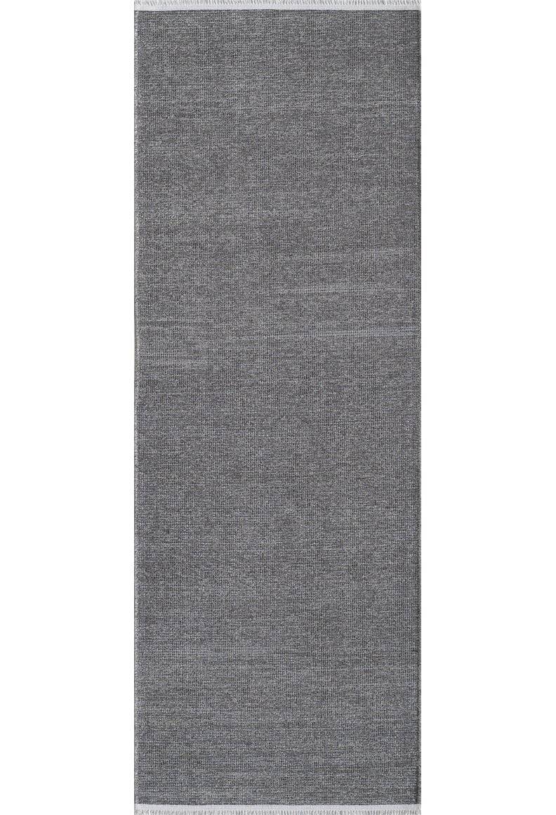 The Velvet Touch Dark Gray Area Rug - PST004 features a rectangular shape, subtle woven texture, and fringed edges in dark gray, highlighting minimalist style on a white background.