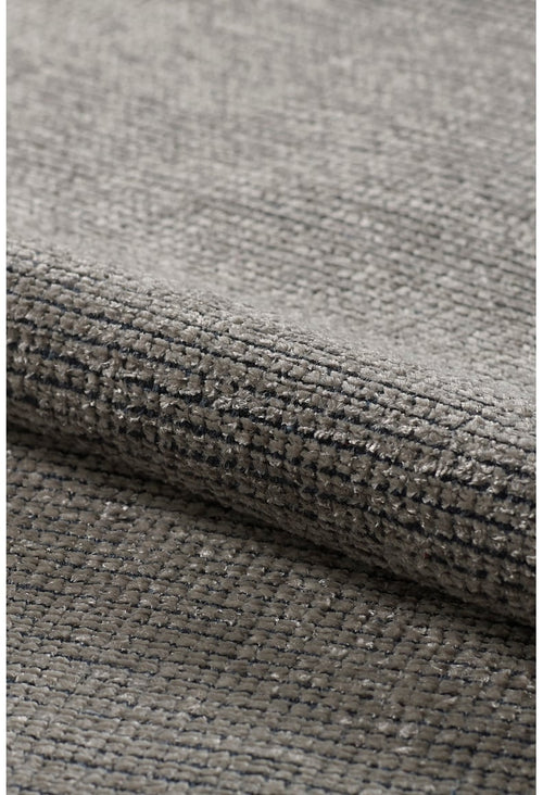Load image 1 in gallery view. Close-up of the Velvet Touch Gray Area Rug - PST003 reveals its textured, woven grey fabric with subtle raised threads—perfect for fans of minimalist, modern rug design.
