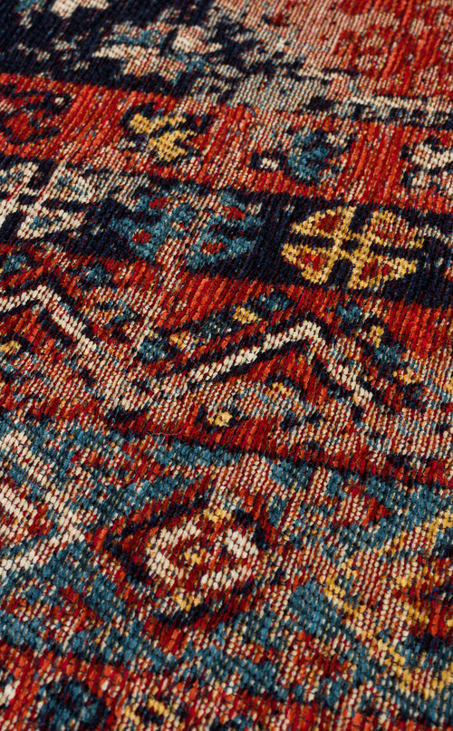 Load image 1 in gallery view. A close-up of the Vintage Echo - Washable Kilims - AND04 rug showcases intricate geometric patterns in red, blue, yellow, and cream with zigzags and symmetrical motifs for a colorful, textured vintage look