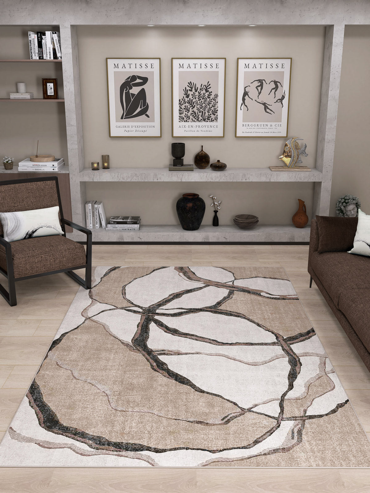 Modern living room with the Vintage Muse - Washable Rug - JRN47, allergy-sensitive and abstract patterned, paired with brown sofas, a wall shelf displaying vases and Matisse prints. Neutral tones, minimalist decor, and wooden flooring complete the space.