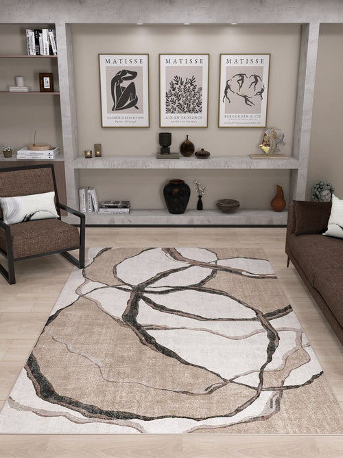 Load image 1 in gallery view. Modern living room with the Vintage Muse - Washable Rug - JRN47, allergy-sensitive and abstract patterned, paired with brown sofas, a wall shelf displaying vases and Matisse prints. Neutral tones, minimalist decor, and wooden flooring complete the space.