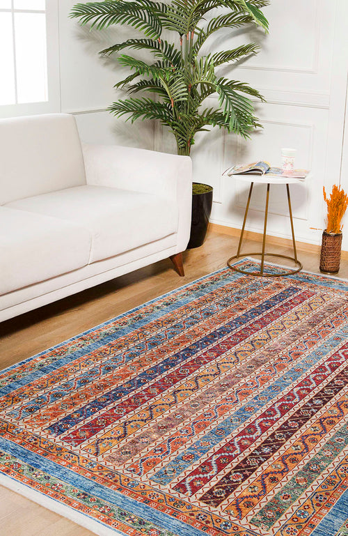 Load image 1 in gallery view. The Vintage Vibes - Washable Rug - JR37 (Custom Size) adds color to a bright room with a wooden floor, white sofa, round side table, magazine, cup, potted plant, and dried flowers—ideal for high-traffic areas.