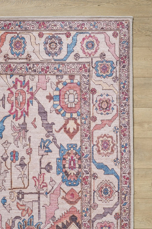 Load image 1 in gallery view. A close-up of the Vivencia Authentic Washable Rug - LCC3016 (Custom Size), featuring geometric and floral patterns in pink, blue, red, and beige on a light wood floor—washable and perfect for allergy-prone homes. Great for cream and beige rug lovers.