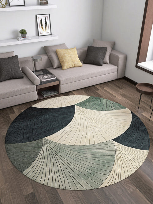 Bild 1 in Galerieansicht laden. A modern living room with two gray sofas, accent pillows, a small wooden side table, and the Vivian Modern Washable Area Rug - MDJ010 featuring abstract leaf patterns in cream, green, and dark blue—ideal for allergy-prone or high-traffic wood floors.