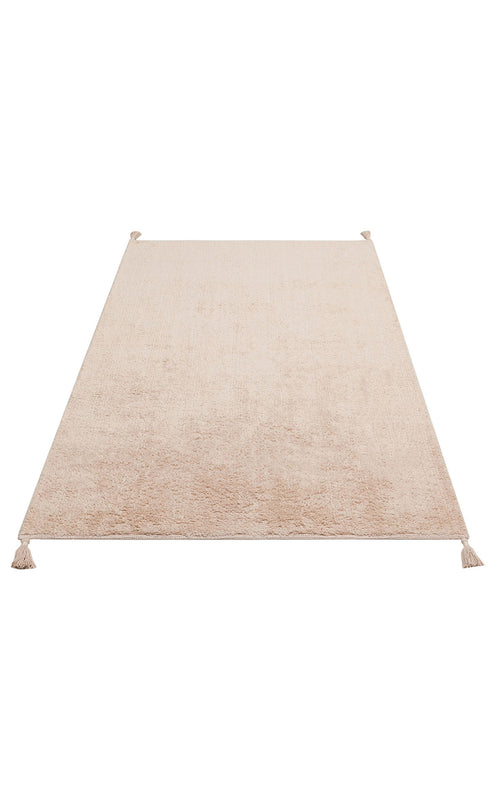 Bild 1 in Galerieansicht laden. The Warm Sand - Washable Shaggy - CBNPLAIN is a rectangular cream beige cotton shag rug with a soft texture and small tassels at each corner, shown on a white background.