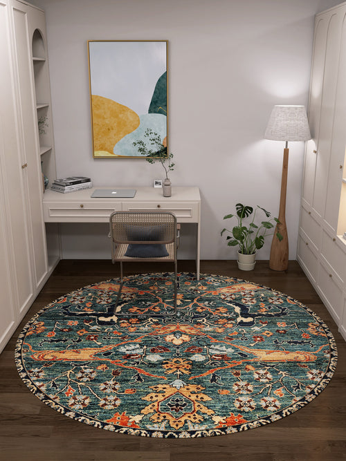 Load image 1 in gallery view. A home office featuring a white desk, transparent chair, Whisper Authentic Blue Washable Rug - LCC3034, floor lamp, potted plant, abstract wall art, and white built-in shelves—ideal for high-traffic areas.