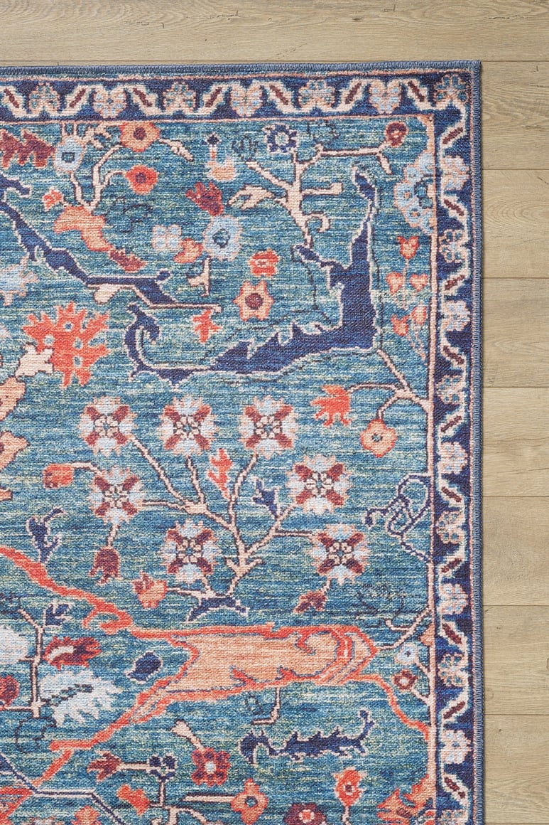 A close-up of the Whisper Authentic Blue Washable Rug - LCC3034 (Custom Size), ideal for high-traffic areas and easy to clean.