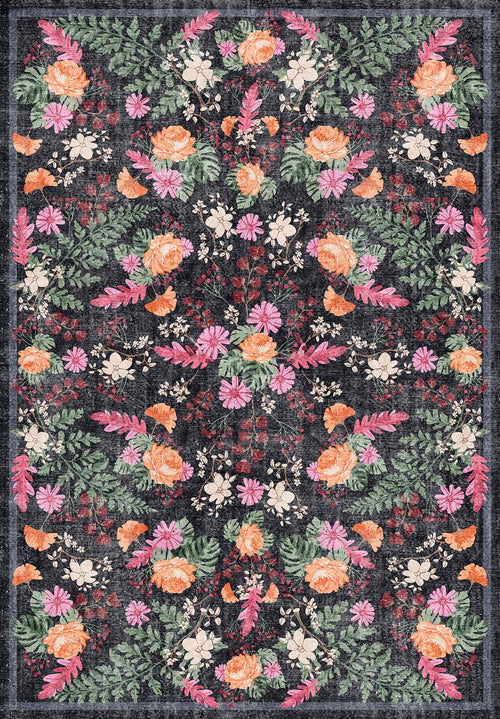 Load image 1 in gallery view. The Woven Grace - Washable Rug - JRN28 is a rectangular flat weave rug with a dark background and a detailed, symmetrical floral pattern in pink, orange, white, and green featuring roses, daisies, and leafy branches.
