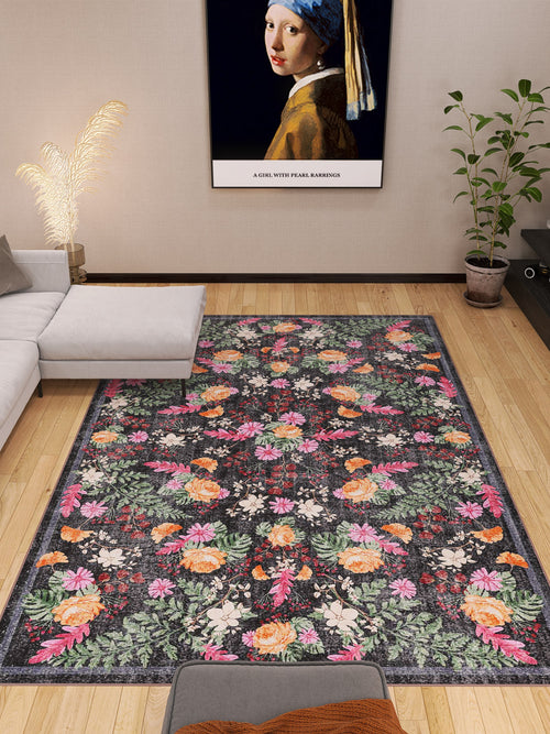 Load image 1 in gallery view. A modern living room with the Woven Grace - Washable Rug - JRN28 (Custom Size), a gray sectional, a potted plant, and a framed Girl with a Pearl Earring print above the sofa. Light wood floors and simple decor complete the look.
