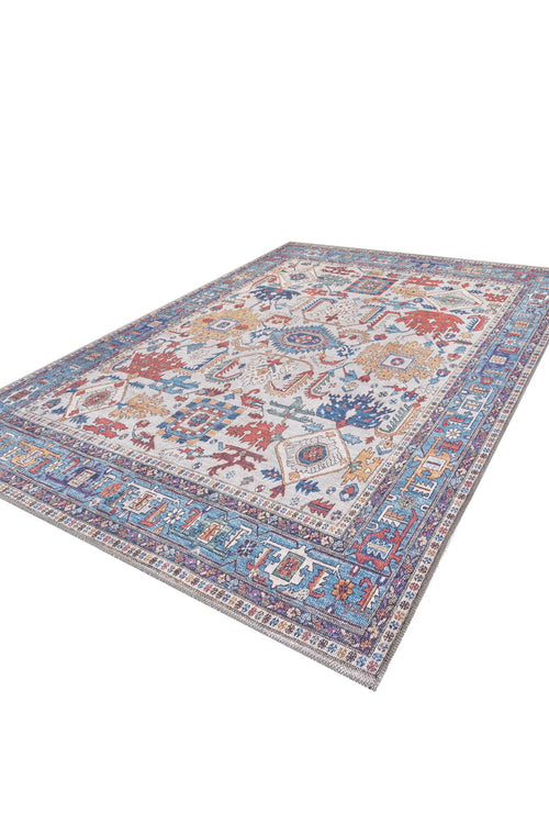 Load image 1 in gallery view. The Yonder Blue Cream Washable Rug (LCC3045) features a large, multicolor floral and geometric pattern in blue, red, orange, and purple with a detailed border—ideal for high-traffic areas. Shown on a white background.