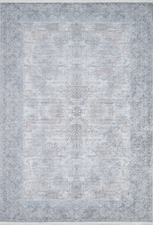 Load image 1 in gallery view. The Ancient Treasure - Washable Rug - JR1785 is a large rectangular rug with an intricate, faded medallion design in gray, blue, and beige tones—ideal for high-traffic areas and easy to clean.