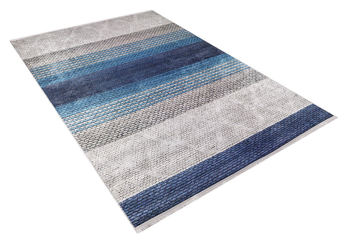 The Artistic Angles - Washable Rug - JR908 is a rectangular blue rug with horizontal stripes in blue, gray, and white and a textured woven pattern, ideal for high-traffic spaces.