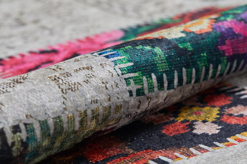 Load image 1 in gallery view. A close-up of the Blooming Paradise - Washable Rug - JR188 shows vibrant geometric and floral patterns in green, pink, red, and black on a textured background—perfect for stylish high-traffic spaces.