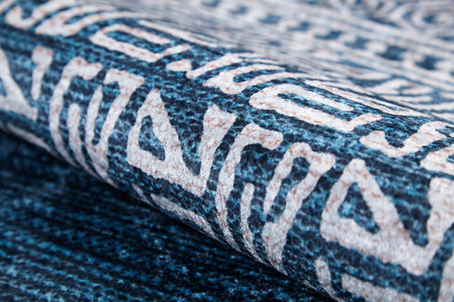 Load image 1 in gallery view. A close-up of the Bohemian Retreat - Washable Rug - JR1589 highlights its textured blue and cream geometric patterns—durable, stylish, and ideal for high-traffic areas.