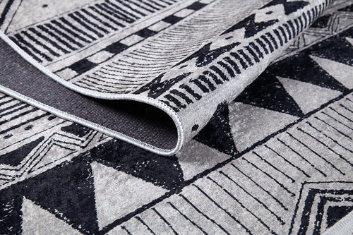 Load image 1 in gallery view. A close-up of the Bohemian Sunrise - Washable Rug - JR1713 shows its black, white, and gray geometric designs and thick texture. The gray-anthracite rug is washable, durable, and ideal for high-traffic areas.