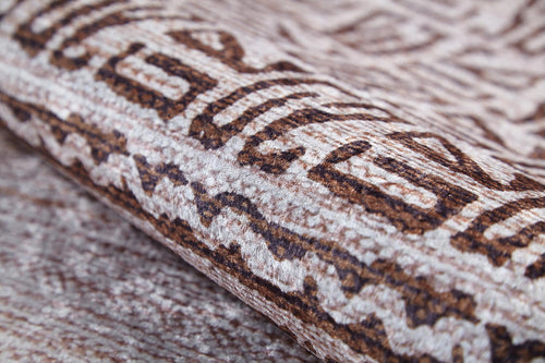Load image 1 in gallery view. A close-up of the Bohemian Treasure - Washable Rug (JR1586) highlights its geometric brown and beige pattern, fine stitching, and soft fibers—an ideal choice for allergy-sensitive homes and busy spaces.