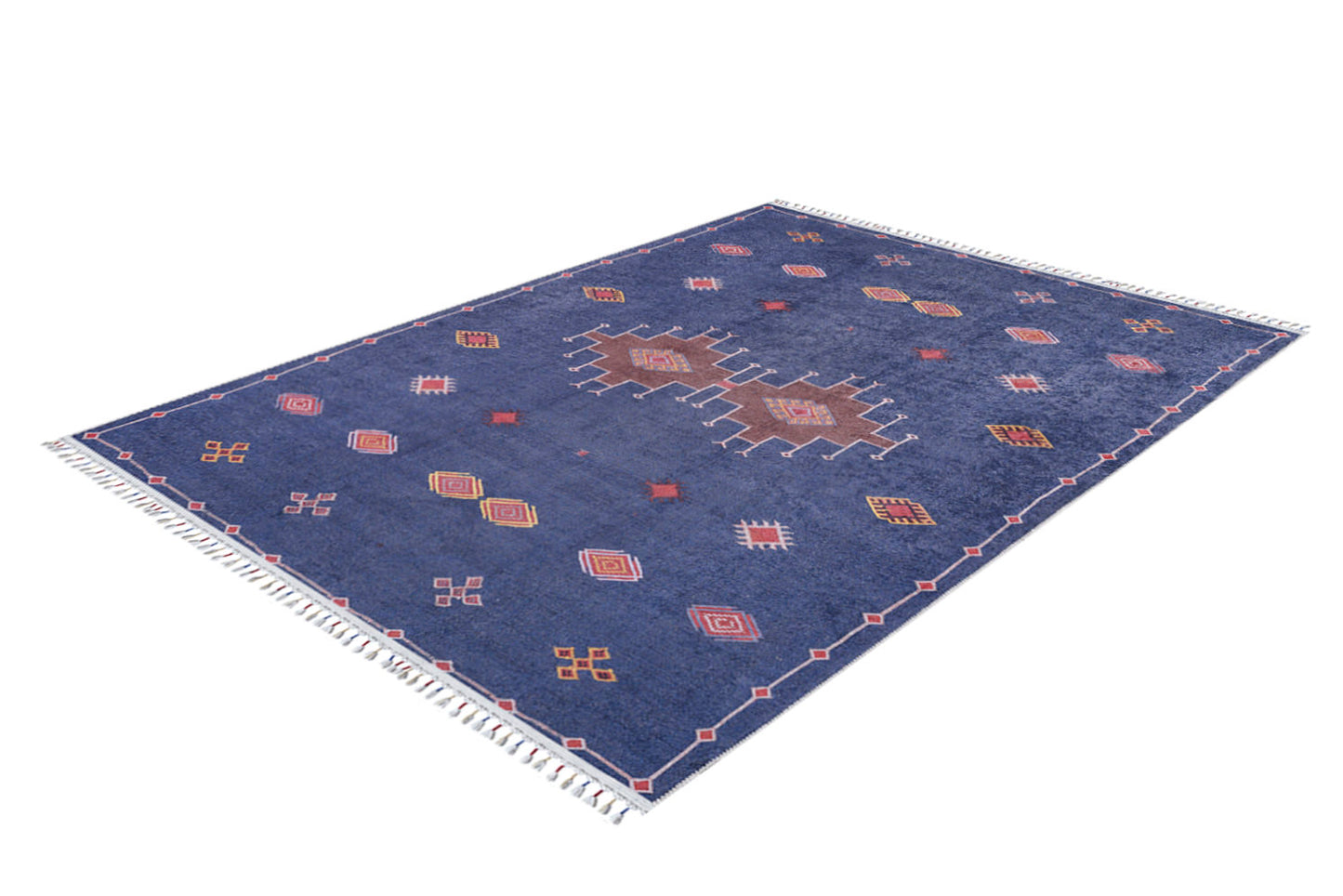 The Boho Chic Tapestry - Washable Rug - JR5083 is a large blue rug with a red, pink, and white geometric pattern and white fringe on the short edges.