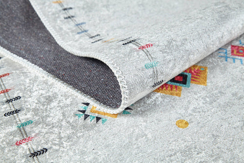 Load image 1 in gallery view. A close-up of the Boho Chic - Washable Rug - JR5103 in light gray, featuring colorful geometric patterns and black arrows. One corner is folded to show its dark underside and stitched edge—ideal for high-traffic areas.