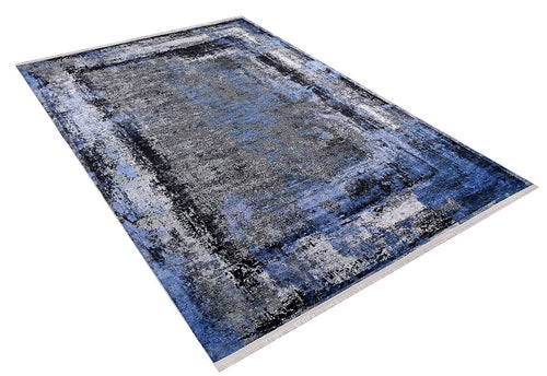 Load image 1 in gallery view. The Bold and Minimalist - Washable Rug - JR1229, with an abstract blue, black, gray, and white design, is shown angled on a white background—perfect for high-traffic areas.