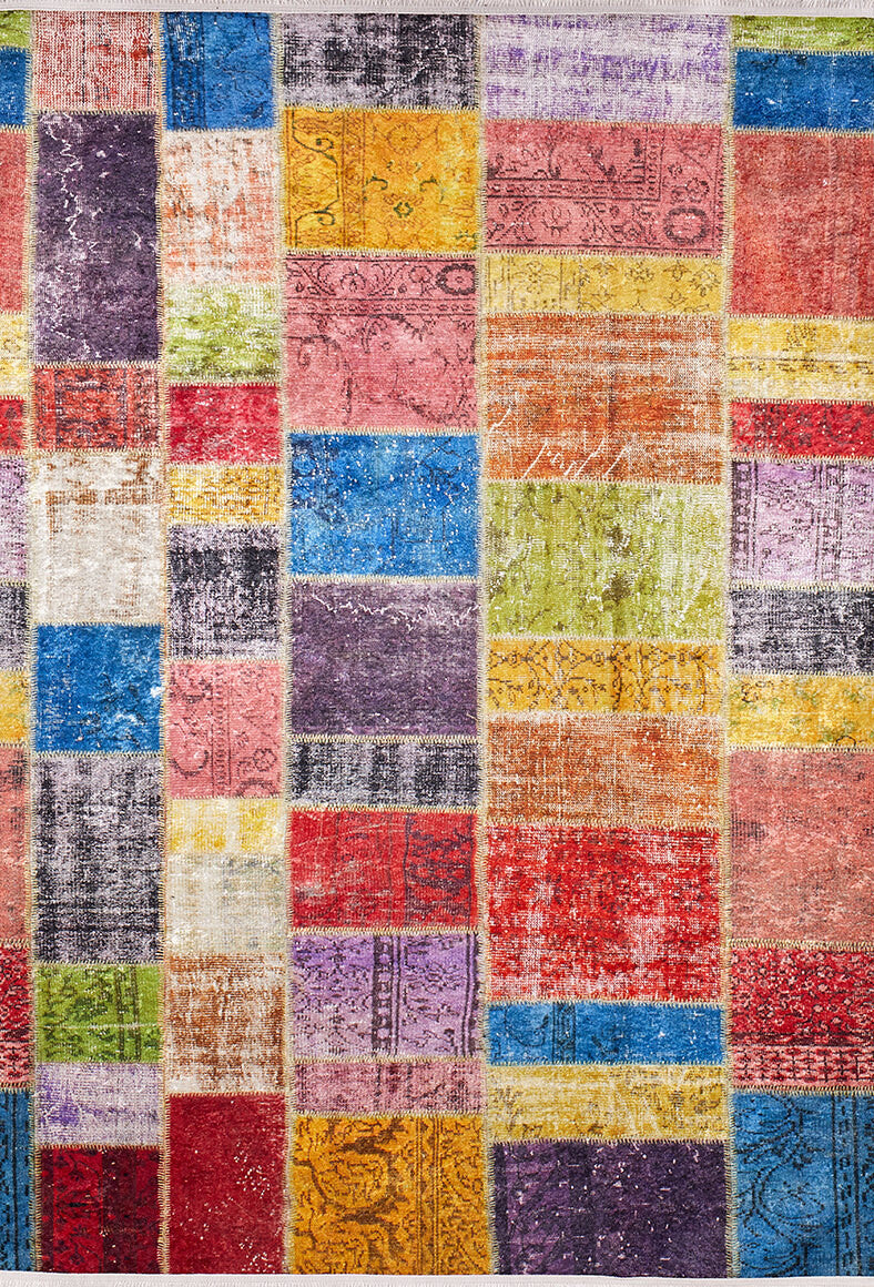 The Crosshatch Craze - Washable Rug - JR210 features bold multicolor rectangular sections with thin yellow borders. This vibrant, washable rug is ideal for high-traffic areas, adding both color and convenience to any space.
