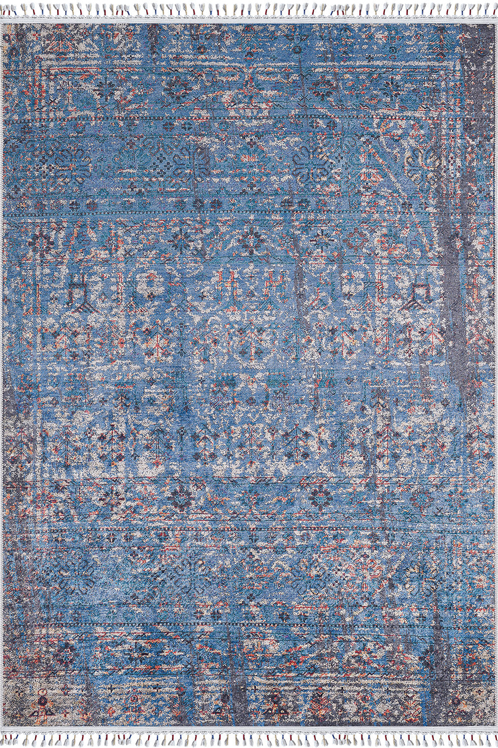 The Desert Diamond - Washable Rug - JR5071 is a rectangular blue rug with intricate, faded floral and geometric patterns in blue, gray, and beige, plus white fringe on the short ends—ideal for high-traffic spaces.