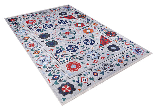 Load image 1 in gallery view. The Desert Drift - Washable Rug - JR1523 features a rectangular, light gray background with colorful red, blue, green, orange, and white geometric and floral patterns plus a flower and diamond border—perfect for high-traffic spaces.