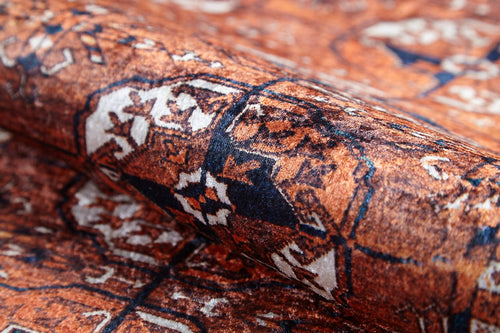 Load image 1 in gallery view. A close-up of the Earthy Enigma - Washable Rug (JR1937), showing its intricate Persian-style geometric and floral patterns in rust orange, navy blue, and cream—perfect for high-traffic areas with a visible woven texture.