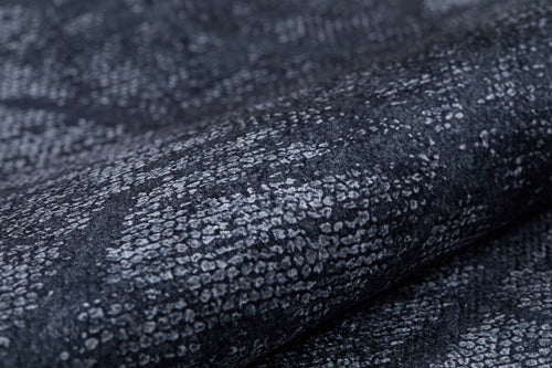 Load image 1 in gallery view. Close-up of the Geometric Gems - Washable Rug - JR1342, featuring a dark gray and black textured pattern with a snakeskin-like design—soft, subtly folded, and perfect for high-traffic areas.