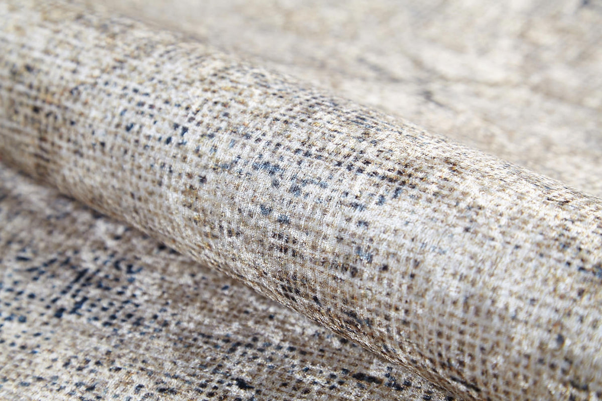Close-up of the Graceful Tapestry - Washable Rug (JR1975), a rolled flat weave with a mottled beige, cream, and brown pattern, small black speckles, and a subtly shiny finish.