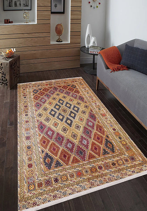 Load image 1 in gallery view. The Grandiose Grace - Washable Rug - JR44, featuring diamond designs, adds color to a modern living room with dark wood floors, a gray sofa, orange throw, small table, décor pieces, and framed art—perfect for high-traffic areas.