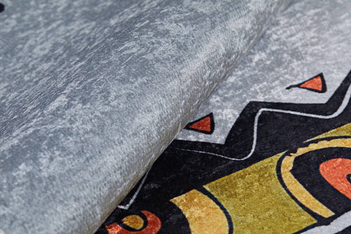 Load image 1 in gallery view. Close-up of the Groovy Bear - Machine-Washable Rug JRC093 in textured gray-anthracite, featuring black, yellow, and orange geometric patterns. Its thick edge is slightly lifted—ideal for high-traffic areas.
