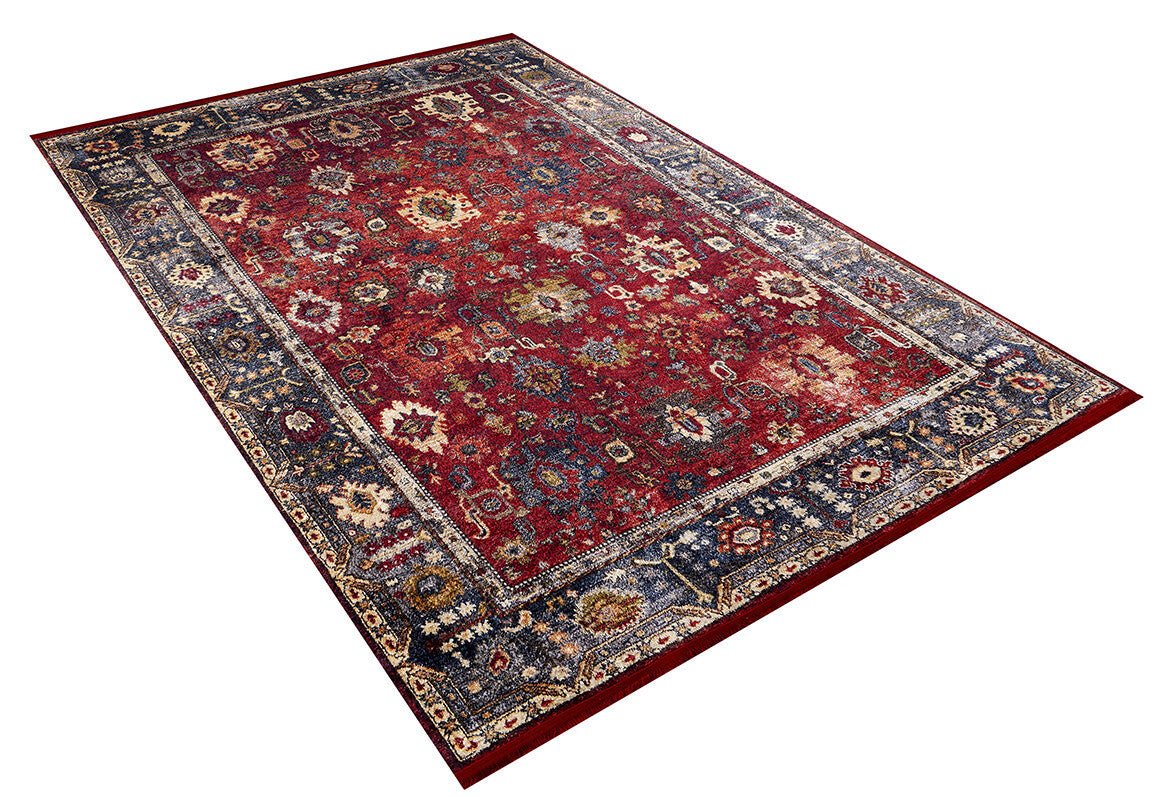 The Historic Hues - Washable Rug - JR898 (Outlet) US is a rectangular red rug with a rich center, detailed floral and geometric designs, and a dark blue border—ideal for high-traffic spaces.