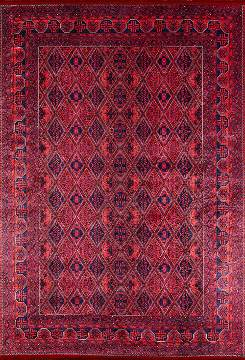 Load image 1 in gallery view. The Imperial Impressions - Washable Rug - JR1132 is a large, rectangular red rug featuring repeating diamond patterns and dark blue geometric motifs with a detailed red and blue border—ideal for high-traffic areas.