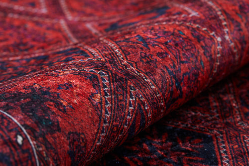Load image 1 in gallery view. Close-up of the Imperial Impressions - Washable Rug - JR1132, featuring rich red tones and detailed geometric and floral patterns; part of the washable rug is rolled up, making it ideal for high-traffic areas.