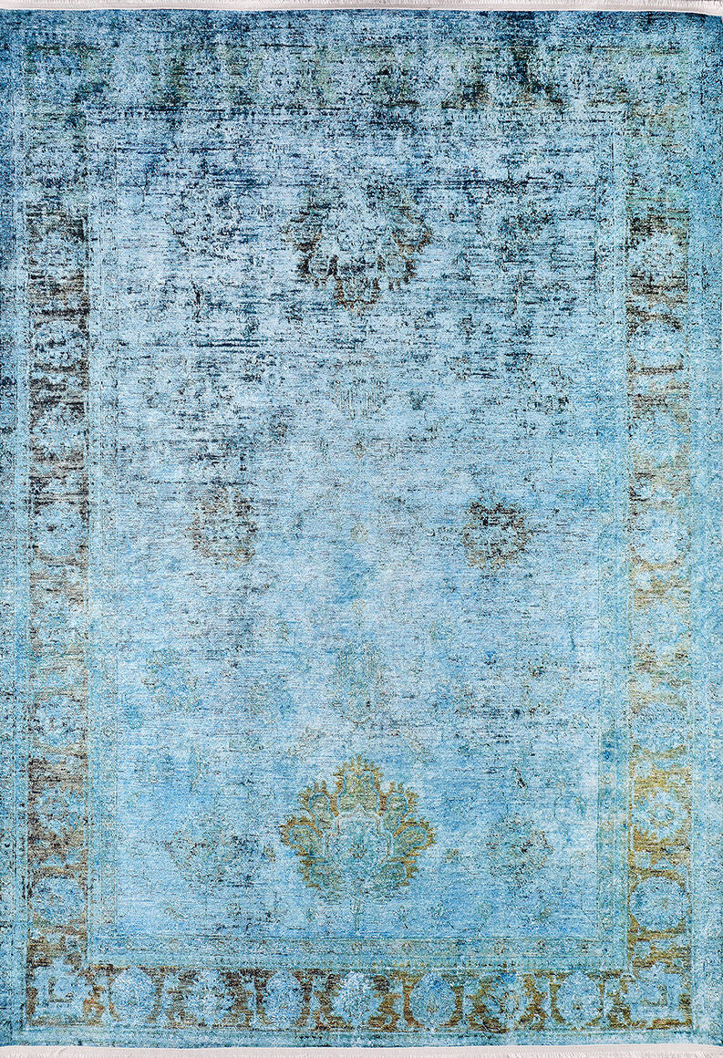 The Imperial Jewel - Washable Rug - JR162 features a faded blue vintage look with a worn, distressed pattern, subtle geometric and floral border designs, and muted leaf-like central motifs—perfect for high-traffic areas.