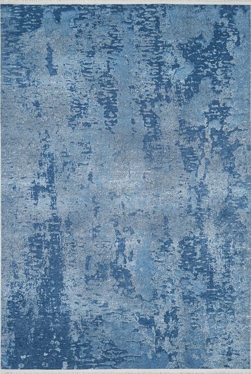 Load image 1 in gallery view. The Ivory Whisper - Washable Rug - JR1628 features a rectangular blue design with abstract blue and light gray patterns, resembling brushstrokes, ideal for high-traffic areas.