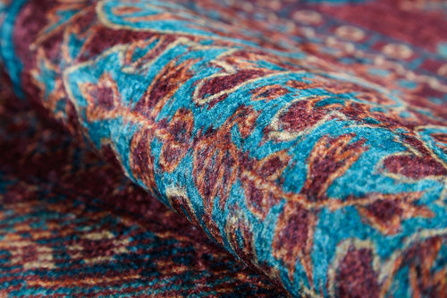 Load image 1 in gallery view. Close-up of the Majestic Mandarin - Washable Rug - JR1863, showcasing its intricate blue, red, and orange pattern. This durable, colorful rug is ideal for high-traffic areas thanks to its sturdy woven design and easy-care washable fabric.