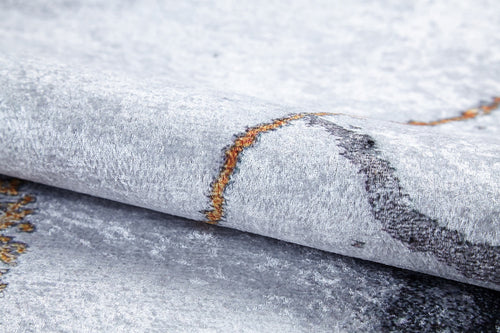Load image 1 in gallery view. A close-up of the Opulent Veins - Machine-Washable Rug JR1593, featuring a light gray textured surface with orange and dark gray abstract patterns—soft, slightly shiny, and ideal for high-traffic areas.