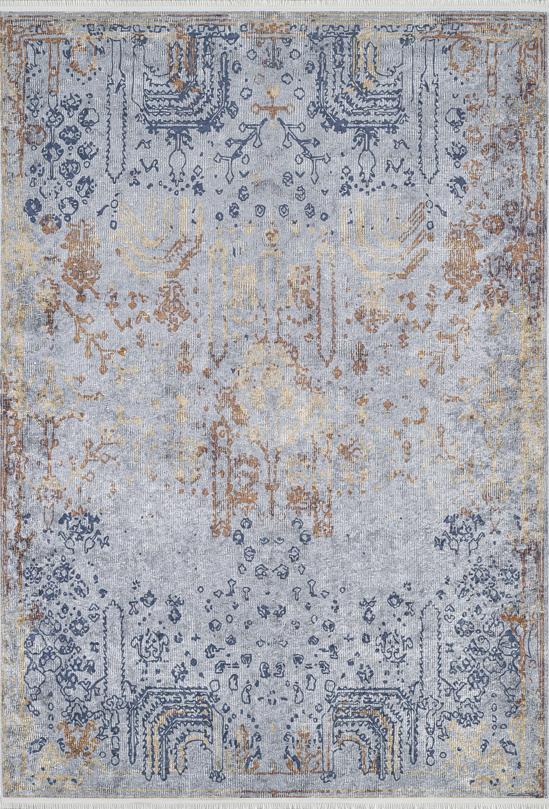 The Oriental Treasures - Machine-Washable Rug JR1613 features a faded blue, gold, and grey vintage pattern with symmetrical motifs—ideal for allergy-sensitive homes and high-traffic areas.