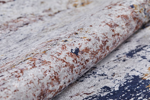 Load image 1 in gallery view. A close-up of the Painted Dreams - Washable Rug - JR432, featuring a textured pattern in white, brown, gray, and navy blue tones—an abstract look that’s perfect for high-traffic areas and easy to clean.